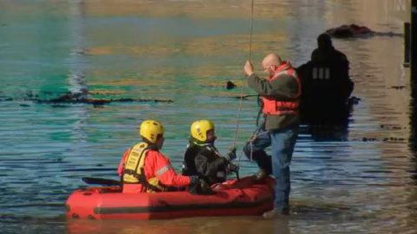 Rescue workers used a rubber raft to rescue stranded motorists in Pittsburgh.