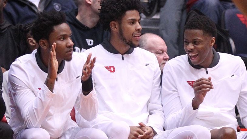 Dayton’s John Crosby, Xeyrius Williams and Kostas Antetokounmpo watch a game against Fordham from the bench on Saturday, Feb. 17, 2018, at UD Arena. David Jablonski/Staff