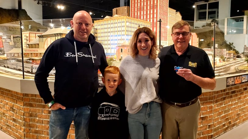 EnterTRAINment Junction owner Don Oeters, right, poses with Victoria and Andrew Royds and their son, Enzo. The Royds family came to West Chester Twp. from New Zealand to see the venue. CONTRIBUTED