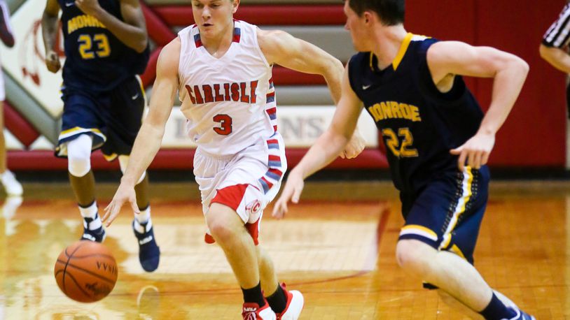Carlisle guard Jake Moore (3) drives up the court during a game against visiting Monroe on Dec. 6, 2016. GREG LYNCH/STAFF