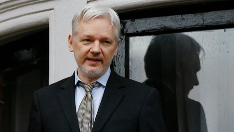 FILE - In this Feb. 5, 2016 file photo, WikiLeaks founder Julian Assange speaks from the balcony of the Ecuadorean Embassy in London. Sweden's top prosecutor said Friday May 19, 2017, she is dropping an investigation into a rape claim against WikiLeaks founder Julian Assange after almost seven years. (AP Photo/Kirsty Wigglesworth, File)