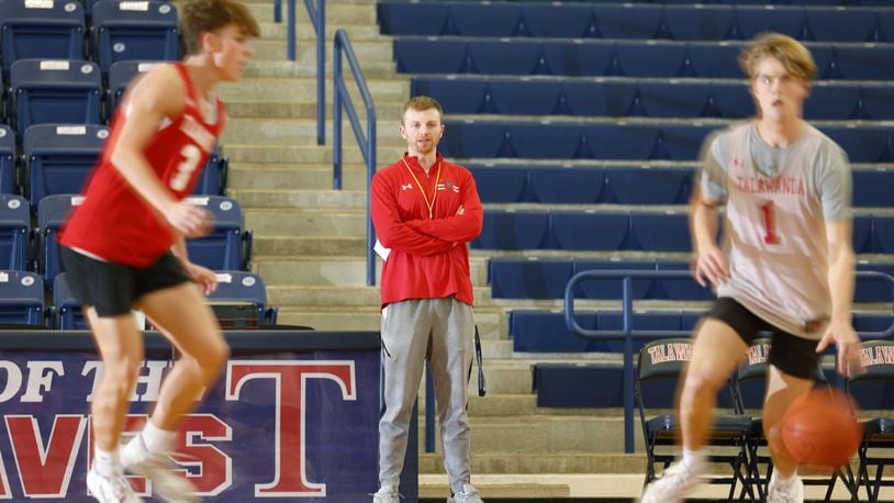 New varsity coach Connor Roberts is one of the youngest head basketball coaches in the area. Roberts, a 2014 graduate from Talawanda, now teaches and coaches where he played basketball in high school. NICK GRAHAM/STAFF