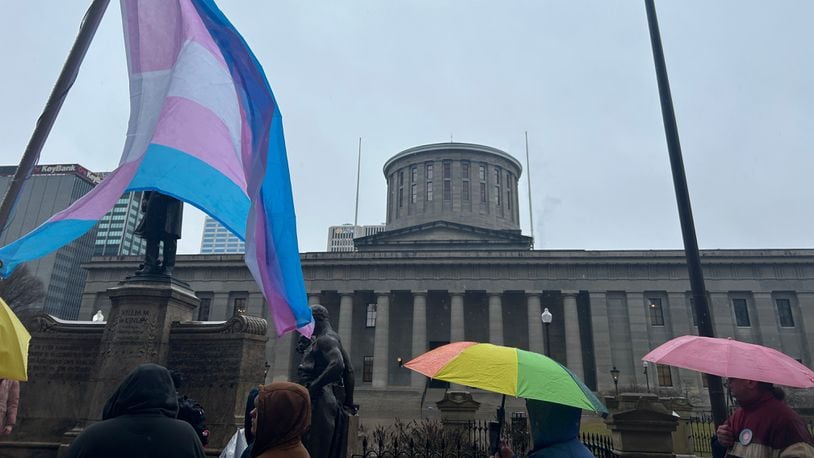 A group of protestors gathered outside the Ohio Statehouse on Wednesday, Jan. 24, 2024, to voice displeasure of the Senate's likely override of Gov. Mike DeWine's veto on a bill that would bar transgender minors from undergoing gender affirming care. AVERY KREEMER/STAFF