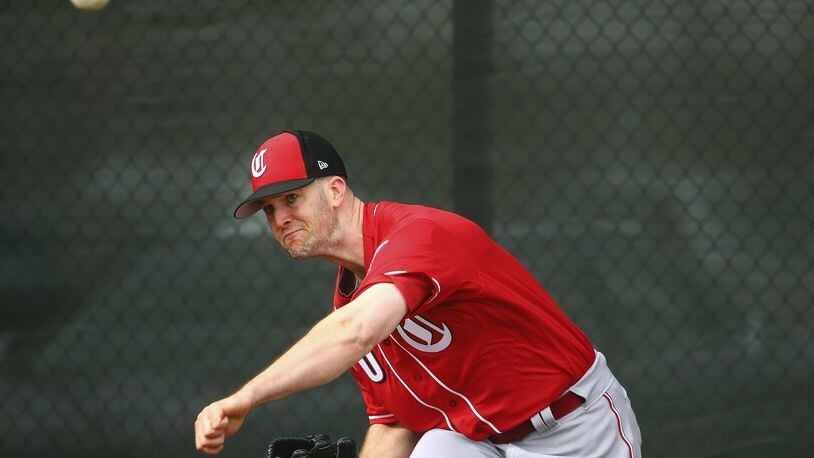 Cincinnati Reds pitcher Alex Wood throws a pitch during workouts at the Reds spring training baseball facility, Wednesday, Feb. 13, 2019, in Goodyear, Ariz. (AP Photo/Ross D. Franklin)