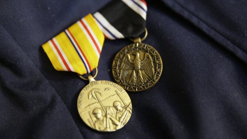 A pair of medals are pinned to the jacket of Bataan Death March survivor Ramon Regalado at his home in El Cerrito, Calif. Survivors of the Bataan Death March in the Philippines are marking the 75th anniversary  of the infamous forced march that occurred in World War II.
