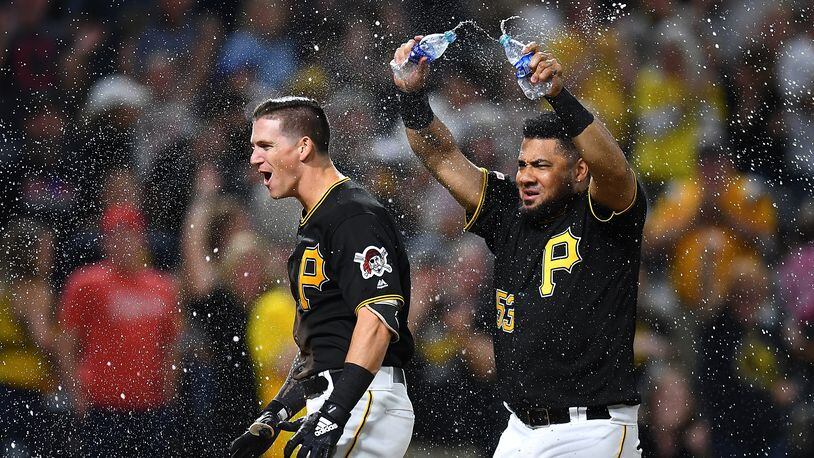 PITTSBURGH, PA - SEPTEMBER 27:  Kevin Newman #27 of the Pittsburgh Pirates celebrates his two run home run with Melky Cabrera #53 during the ninth inning against the Cincinnati Reds at PNC Park on September 27, 2019 in Pittsburgh, Pennsylvania. (Photo by Joe Sargent/Getty Images)
