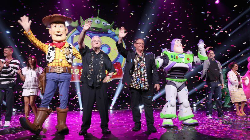 ANAHEIM, CA - AUGUST 14: Composer Randy Newman of TOY STORY 1, 2 and 3 and director John Lasseter of TOY STORY 4 (C) took part today in 'Pixar and Walt Disney Animation Studios: The Upcoming Films' presentation at Disney's D23 EXPO 2015 in Anaheim, Calif. (Photo by Jesse Grant/Getty Images for Disney)