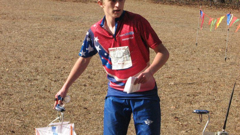 USA Junior National Team Member Dylan Poe (of Liberty, Indiana) visits a control point at a previous January Orienteering event. SUBMITTED PHOTO