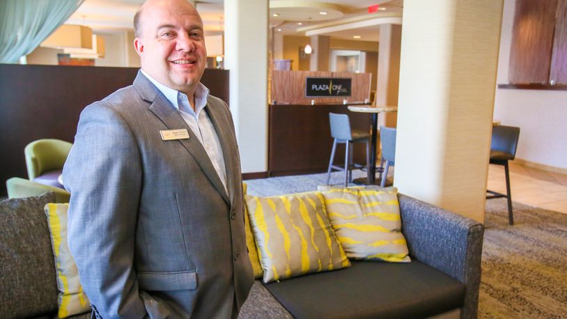 Courtyard by Marriott Hamilton General Manager Shawn Stidham in the newly renovated lobby at the hotel, Wednesday, July 5, 2017. GREG LYNCH / STAFF