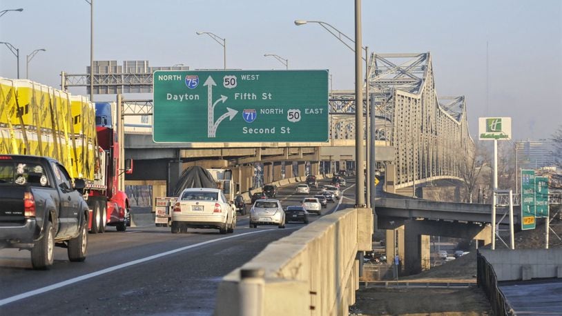 Two lanes of Interstate 71/75 in each direction over the Brent Spence Bridge could close as early as Friday for approximately two months. Bridge deck repair and structural maintenance will close lanes and impact ramps and traffic flow, according to Kentucky Transportation Cabinet officials. MICHAEL D. PITMAN / 2015