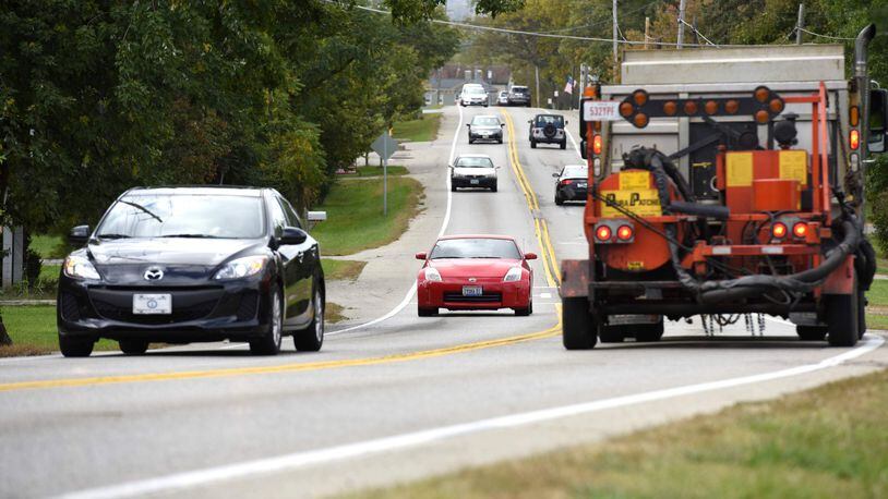 Motorists drive on Cincinnati-Dayton Road between West Chester Road and Interstate 75, a 1-mile stretch of road where improvements are planned to accommodate existing and projected traffic, reduce roadway congestion and improve motorist safety. NICK GRAHAM/STAFF