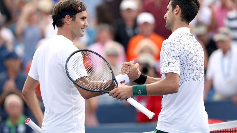 MASON, OH - AUGUST 19: Roger Federer of Switzerland congratulates Novak Djokovic of Serbia after their match during the men’s final of the Western & Southern Open at Lindner Family Tennis Center on August 19, 2018 in Mason, Ohio. (Photo by Matthew Stockman/Getty Images)