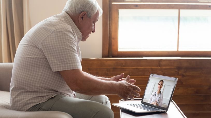 An older man makes a telehealth call. CONTRIBUTED