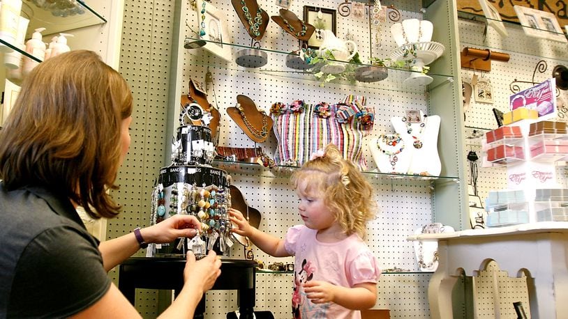 Becky Lawson and her daughter, Anna, shop at Pleasantree Gift Shoppe in this 2008 photo. Pleasantree’s owners said this week they will retire in February and close the store, which first opened 1988. STAFF FILE PHOTO