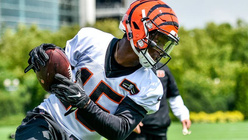 Wide receiver John Ross catches a pass during the first day of Cincinnati Bengals Training Camp Friday, July 28 at the practice fields beside Paul Brown Stadium in Cincinnati. NICK GRAHAM/STAFF