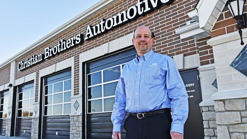 Doug Beachy, the new owner of West Chester Twp.’s Christian Brothers Automotive, is dedicated to doing charitable works via the business. NICK GRAHAM/STAFF