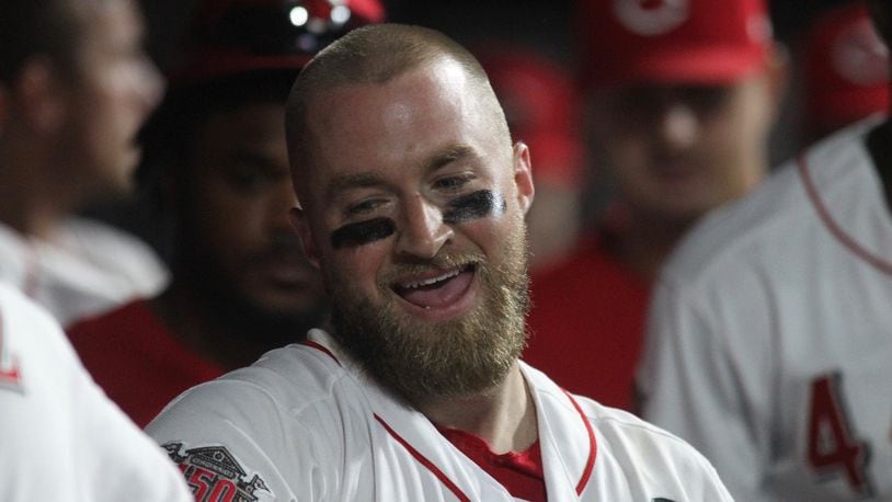 Reds catcher Tucker Barnhart smiles in the dugout after a home run against the Angels on Tuesday, Aug. 6, 2019, at Great American Ball Park in Cincinnati. David Jablonski/Staff