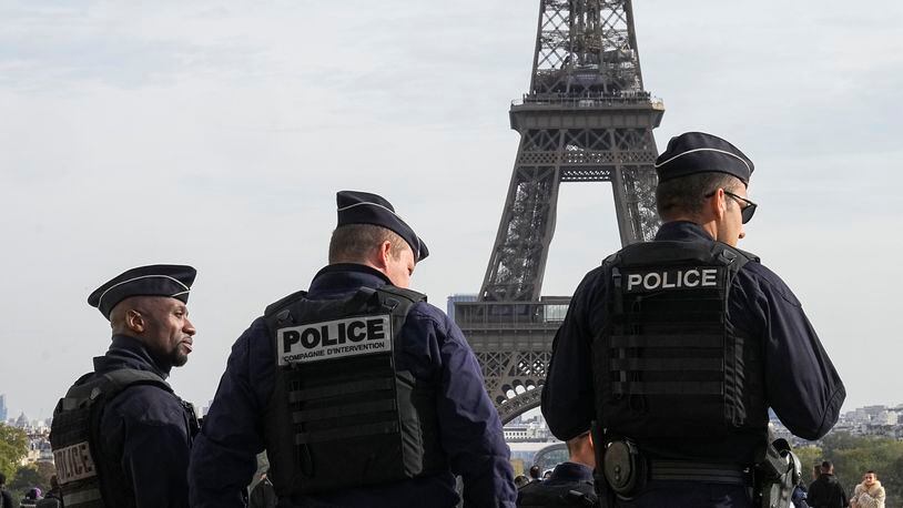FILE - Police officers patrol the Trocadero plaza near the Eiffel Tower in Paris, Tuesday, Oct. 17, 2023. France says it has asked 46 countries if they can supply more than 2,000 police officers to help secure the Paris Olympics. Organizers are finalizing security planning for the July 26-Aug. 11 Games, the French capital’s first in a century. (AP Photo/Michel Euler, File)
