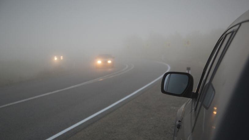 FILE PHOTO: Fog mixed with smoke blanketed Houston making driving difficult.
