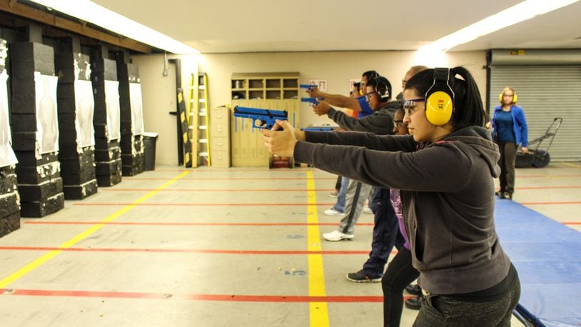 Participants in Hamilton Police Department’s Hispanic Police Academy learn about firearms safety. The Middletown Police Department is planning to restart its Citizen Police Academy in 2018. CONTRIBUTED
