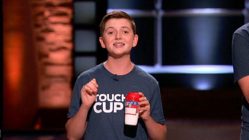 Carson Grill, 15, a freshman at Fenwick High School, and his father, Jason, will appear on "Shark Tank" Friday night. They will pitch Carson’s paint saving invention, The Touch Up Cup. SUBMITTED PHOTO