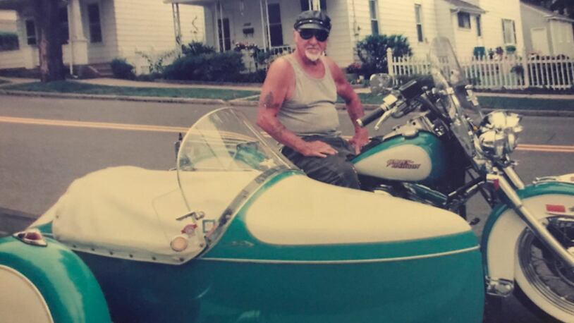 In this 2010 photo provided by the family of Arthur Werner Sr., Werner poses for a photo on his 1990 Harley-Davidson Heritage Softail motorcycle in Bethlehem, Pa. Werner, of Steel City, Pa., died of cancer Sunday, June 25, 2017, but made plans to be buried in his motorcycle's sidecar after his funeral scheduled Friday, June 30, 2017. (Brittany Werner via AP)