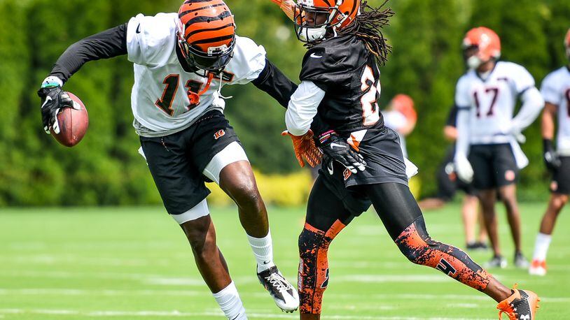 Wide receiver Brandon LaFell makes a catch defended by cornerback Adam Jones during the first day of Cincinnati Bengals Training Camp Friday, July 28 at the practice fields beside Paul Brown Stadium in Cincinnati. NICK GRAHAM/STAFF