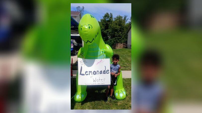 A five-year-old Fairfield Township boy surprised his school principal with a $1,020 donation from his summer lemonade stand. With help from his dinosaur friend - and savvy social media advertising - Cayden Cummings was able to hand over a check surprising school officials. (Provided Photo\Journal-News)