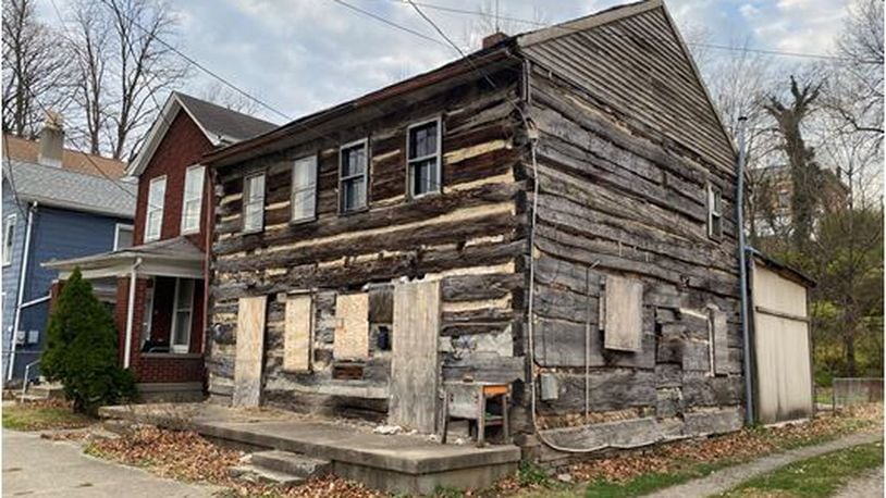 This log cabin dating to 1900 at 223-225 S. C St. is being offered for sale by the city of Hamilton. PROVIDED