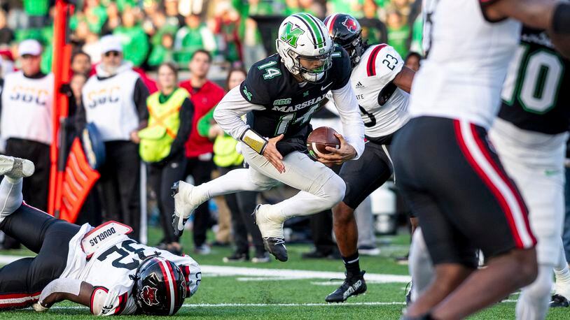 Marshall quarterback Cam Fancher (14) dives in for a rushing touchdown against Arkansas State during an NCAA college football game Saturday, Nov. 25, 2023, in Huntington, W.Va. (Sholten Singer/The Herald-Dispatch via AP)