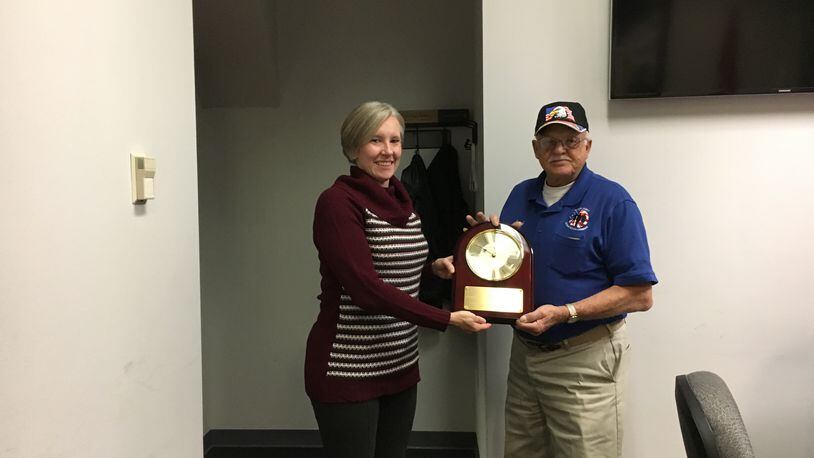 Butler County Veterans Service Commission Executive Director Caroline Bier presents retiring Commissioner Lowell Stewart with a plaque at his last meeting on the board in2017.