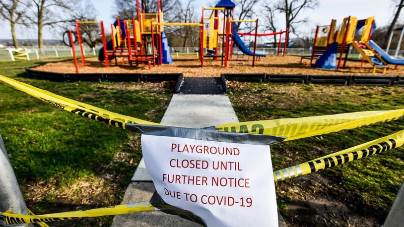 The playgrounds at Smith Park in Middletown has caution tape and signs indicating it is closed due to COVID-19. Many playgrounds in Butler County are off limits as a precaution against the spread of coronavirus. NICK GRAHAM / STAFF