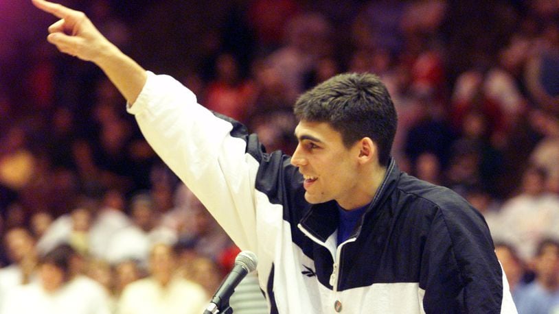 Wally Szczerbiak acknowledges the crowd at a pep rally for the Miami Redhawks before they boarded the bus for the NCAA ‘Sweet 16’ game against Kentucky in St. Louis on Friday. The rally was held in Millet Hall. STAFF FILE PHOTO