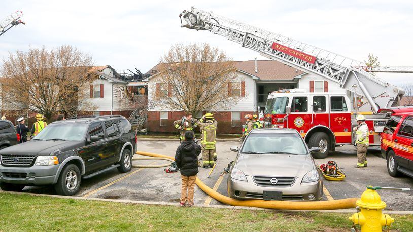 West Chester Twp. fire department responded with mutual aid to a fire at the Meadow Ridge apartment complex, near Muhlhauser Road in West Chester, Monday, Mar. 20, 2017. Three people suffered smoke inhalation and up to 10 families will be displaced due to the fire. GREG LYNCH / STAFF