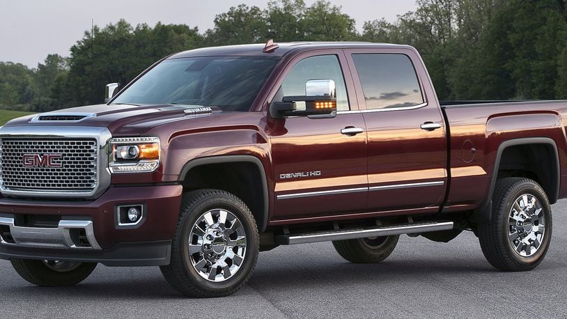 The 2017 GMC Sierra Denali is offered exclusively as a crew cab and includes a signature chrome grille, 18-inch chrome aluminum wheels (17-inch polished aluminum with dual rear wheels), body-color front and rear bumpers, specific interior details, exclusive 8-inch customizable driver display, wireless phone charging and more. GMC photo