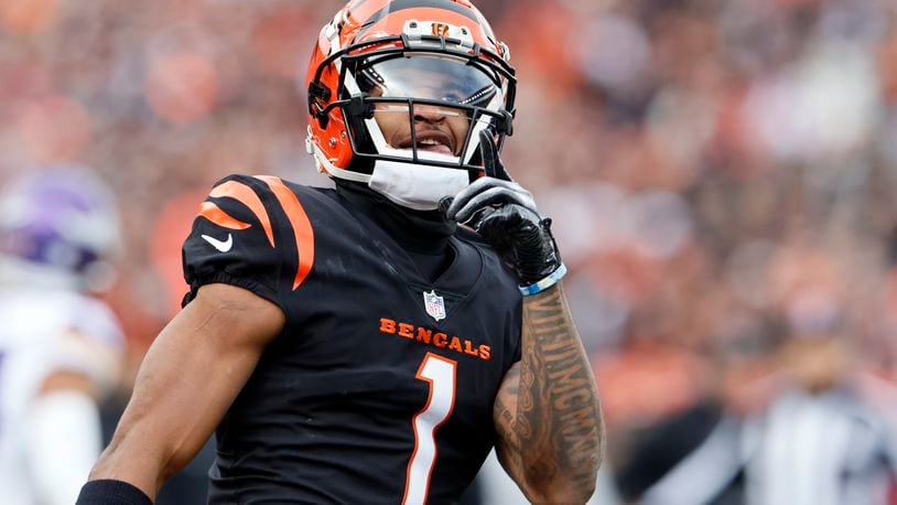 Cincinnati Bengals wide receiver Ja'Marr Chase (1) reacts after making a catch during the first half of an NFL football game against the Minnesota Vikings, Saturday, Dec. 16, 2023, in Cincinnati. (AP Photo/Jay LaPrete)