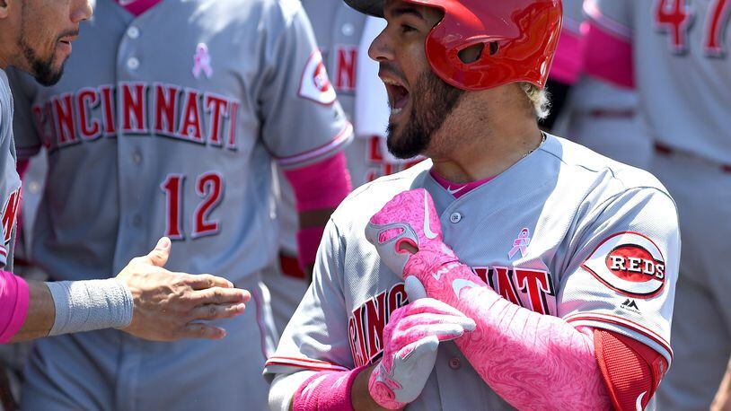 LOS ANGELES, CA - MAY 13: Eugenio Suarez #7 of the Cincinnati Reds is greeted in the dugout after a two run home run in the third inning of the game against the Los Angeles Dodgers at Dodger Stadium on May 13, 2018 in Los Angeles, California. (Photo by Jayne Kamin-Oncea/Getty Images)