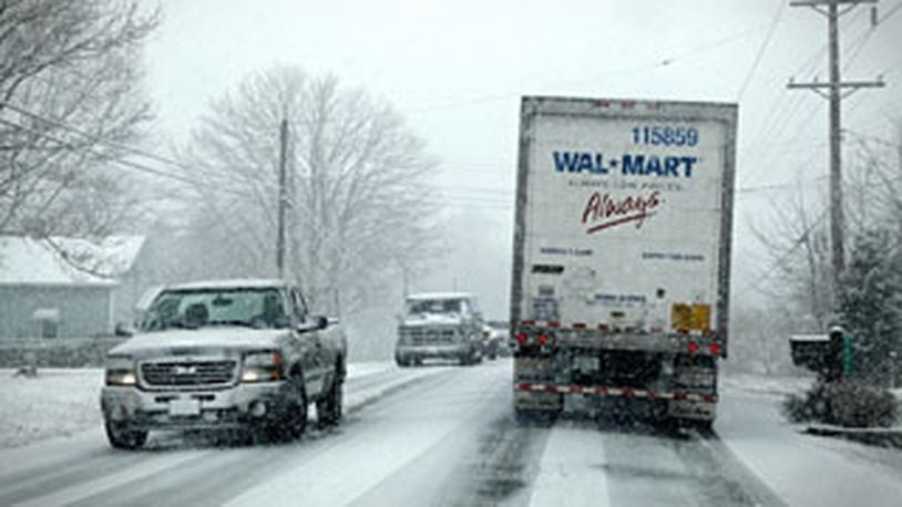 Drivers found themselves stuck on Ohio 63 in Lebanon at about noon on Wednesday Feb. 13, 2013, as snow falls. (Jim Noelker/Staff)