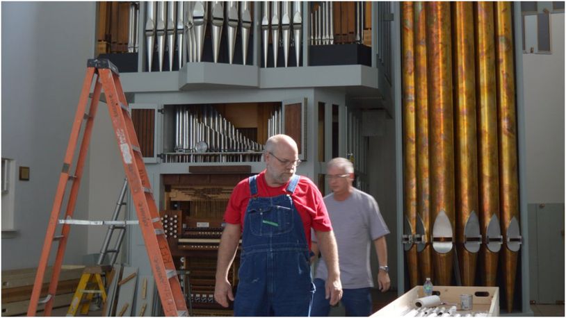 Paul Nordlie, front, and tonal director Eric Grame look for a needed part for the organ being installed in Holy Trinity Episcopal Church as it took shape. The congregation is looking to use it for its Oct. 1 service. CONTRIBUTED/BOB RATTERMAN