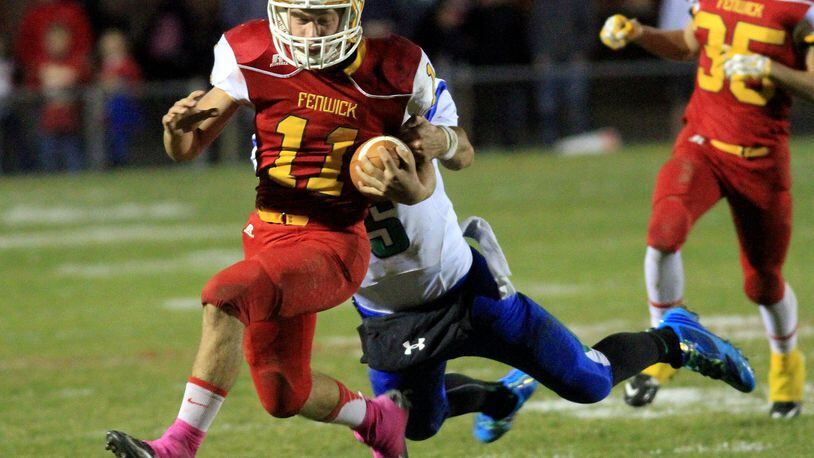 Fenwick running back Warren Kusneske picks up a first down before Chaminade Julienne defensive back Jacob Harrison pulls him down late in the second quarter during their game at Fenwick’s Krusling Field on Oct. 24, 2014. CONTRIBUTED PHOTO BY E.L. HUBBARD