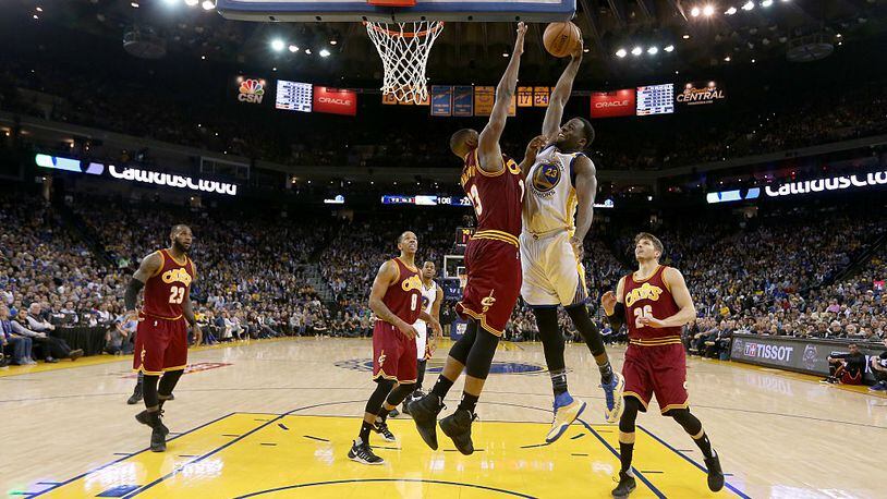 OAKLAND, CA - JANUARY 16: Draymond Green #23 of the Golden State Warriors goes up for a shot on Tristan Thompson #13 of the Cleveland Cavaliers at ORACLE Arena on January 16, 2017 in Oakland, California. NOTE TO USER: User expressly acknowledges and agrees that, by downloading and or using this photograph, User is consenting to the terms and conditions of the Getty Images License Agreement. (Photo by Ezra Shaw/Getty Images)