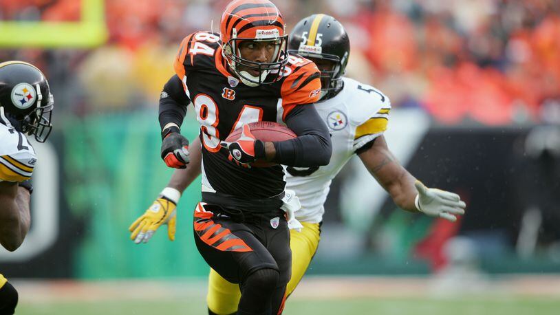 CINCINNATI, OH - OCTOBER 23: Wide receiver T.J. Houshmandzadeh #84 of the Cincinnati Bengals carries the ball against the Pittsburgh Steelers during the NFL game at Paul Brown Stadium on October 23, 2005 in Cincinnati, Ohio. The Steelers won 27-13. (Photo by Andy Lyons/Getty Images)