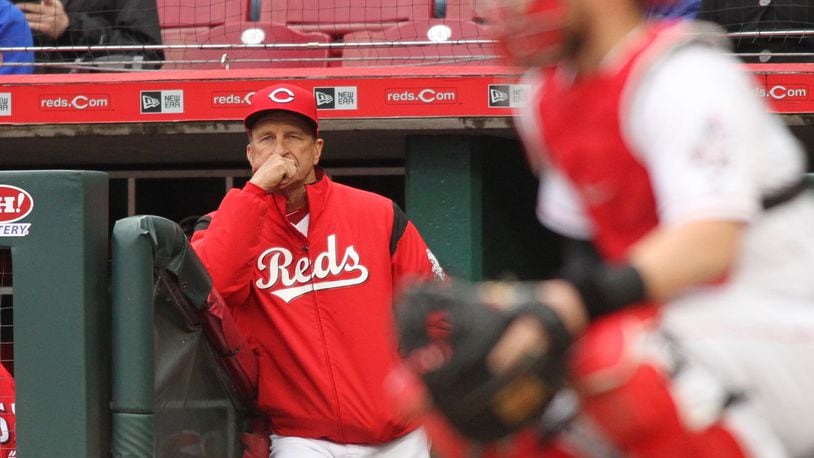 Reds manager Jim Riggleman watches a game against the Braves on April 23, 2018, at Great American Ball Park in Cincinnati.
