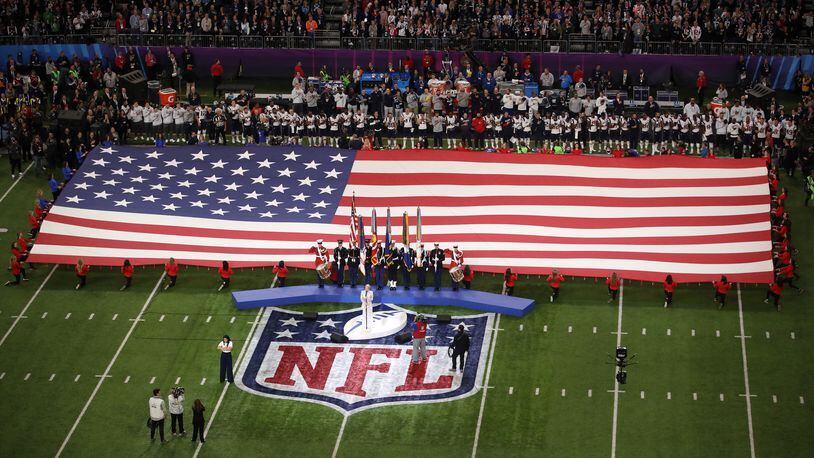 MINNEAPOLIS, MN - FEBRUARY 04:  Pink sings the national anthem prior to Super Bowl LII between the New England Patriots and the Philadelphia Eagles at U.S. Bank Stadium on February 4, 2018 in Minneapolis, Minnesota.  (Photo by Christian Petersen/Getty Images)