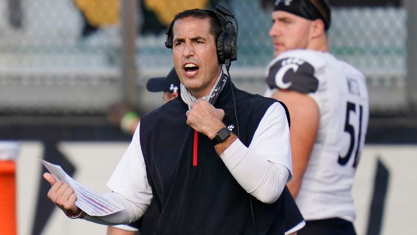FILE - Cincinnati head coach Luke Fickell shouts instructions to his players during the first half of an NCAA college football game against Central Florida in Orlando, in this Saturday, Nov. 21, 2020, file photo. Fickell knew he might surprise some by suggesting No. 11 Georgia is the best team Cincinnati has faced in his four seasons as head coach. (AP Photo/John Raoux, File)