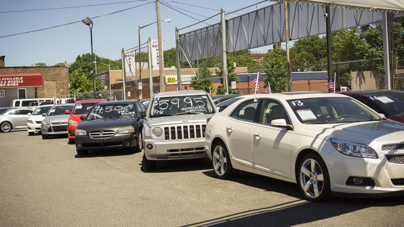 A dealer in used cars in the Woodside neighborhood of Queens in New York. Many “buy here, pay here” car dealers use starter interrupt devices called “kill switches” that will turn off the car if the owner misses a payment. (Richard B. Levine/Sipa USA/TNS)