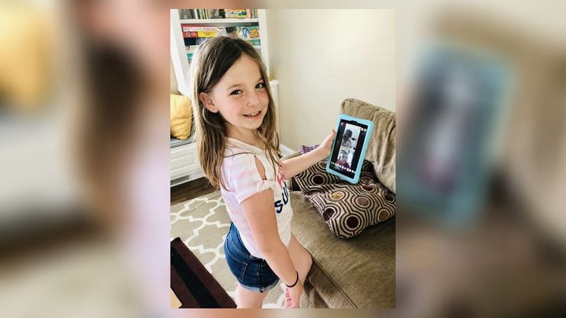 Laura Meder, 7, shows how she stays connected with her friends by using Facebook messenger. SUBMITTED PHOTO