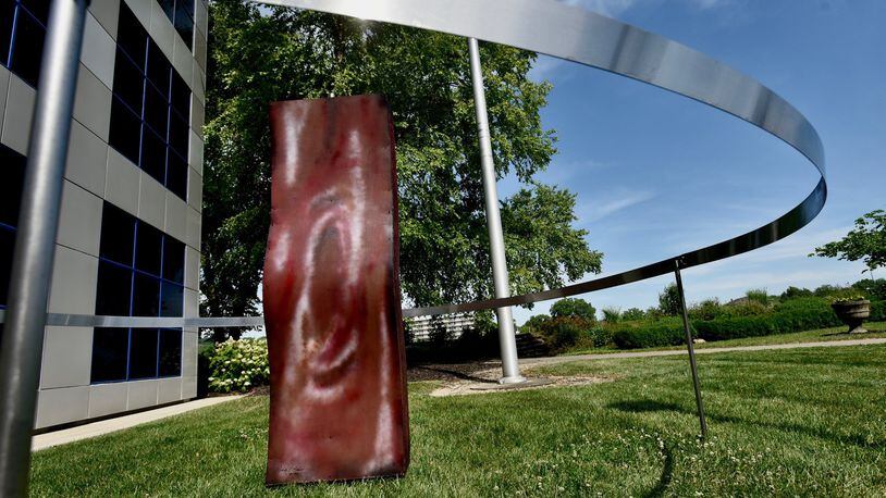 The sculpture, “6 Feet from Kevin’s Bacon” now can be seen on the lawn north of the Fitton Center for Creative Arts, after initially being installed by Hamilton sculptor Nick Bauer. NICK GRAHAM/STAFF