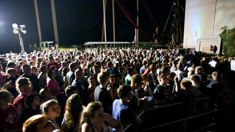 Hundreds waited in line and gathered for an announcement just after 10 p.m. that turned out to be the Mystic Timbers wooden roller coaster Thursday night, July 29, 2016, at Kings Island Amusement Park in Mason. The coaster will be completed in spring of 2017. NICK GRAHAM/STAFF