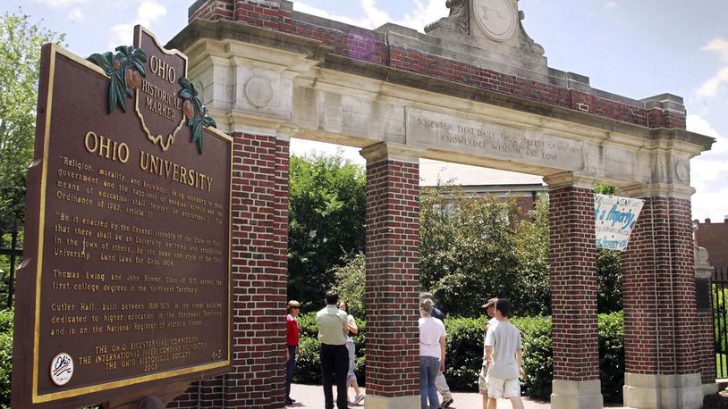 FILE - A historical marker stands near the gate at the Ohio University campus in Athens, Ohio on June 12, 2006.  Universities that adopted COVID-19 vaccine mandates this fall of 2021, have seen widespread compliance. That's true even though many schools made it easy to get out of the shots by granting exemptions to nearly any student who requested one. (AP Photo/Joe Maiorana, File)